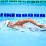 A person swimming in a swimming pool