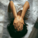 a woman lying in bed.