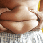 Person holding on belly fat