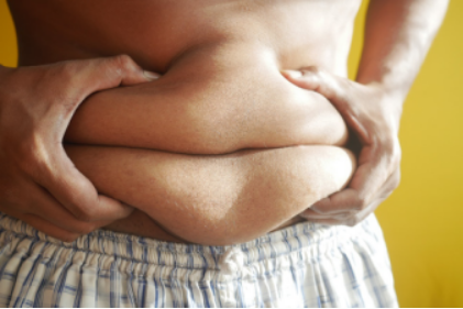 Person holding on belly fat
