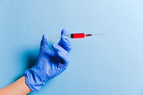 A syringe in a hand