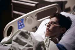 A patient resting on a hospital bed