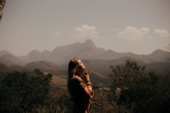 A woman standing in a mountainous region