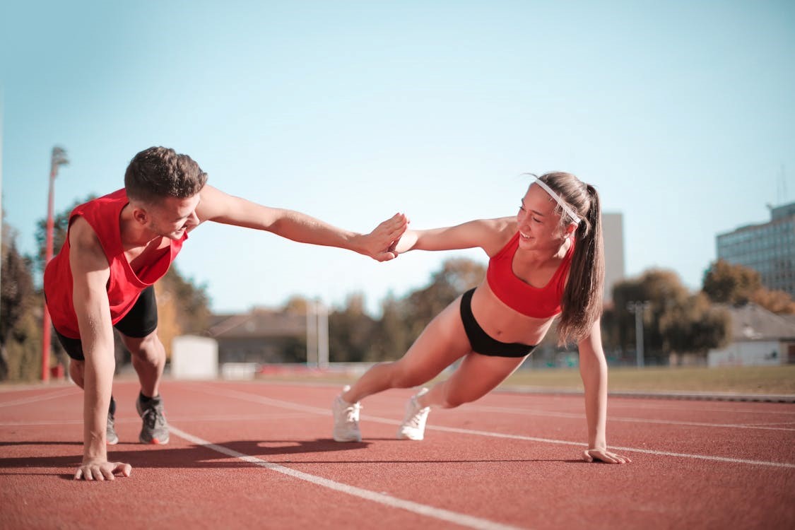 Two athletes exercising together