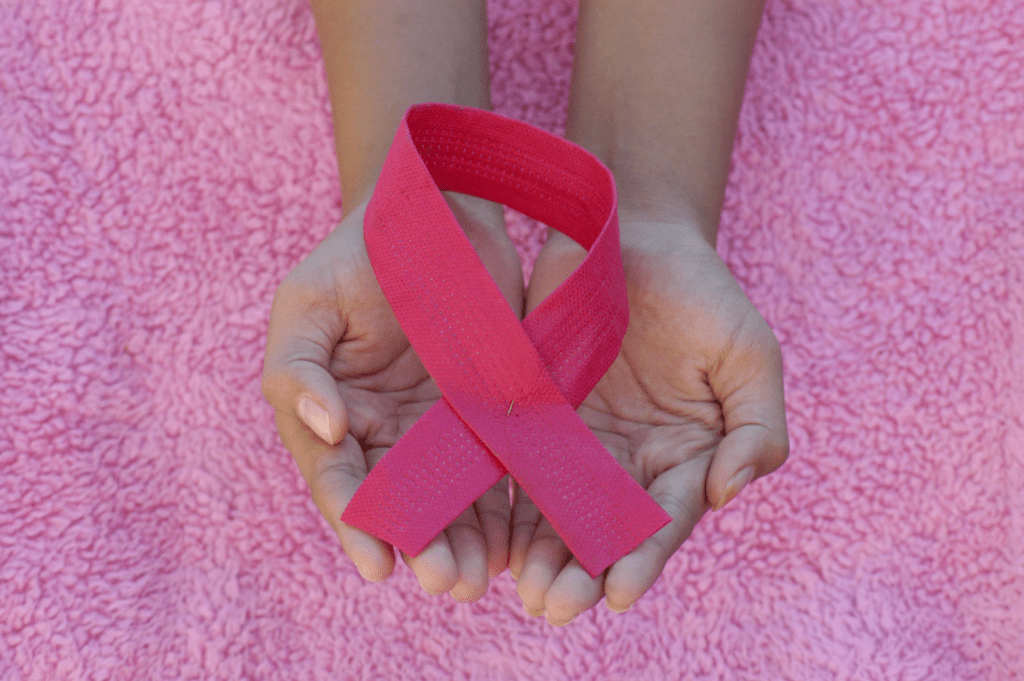 a person holding a ribbon