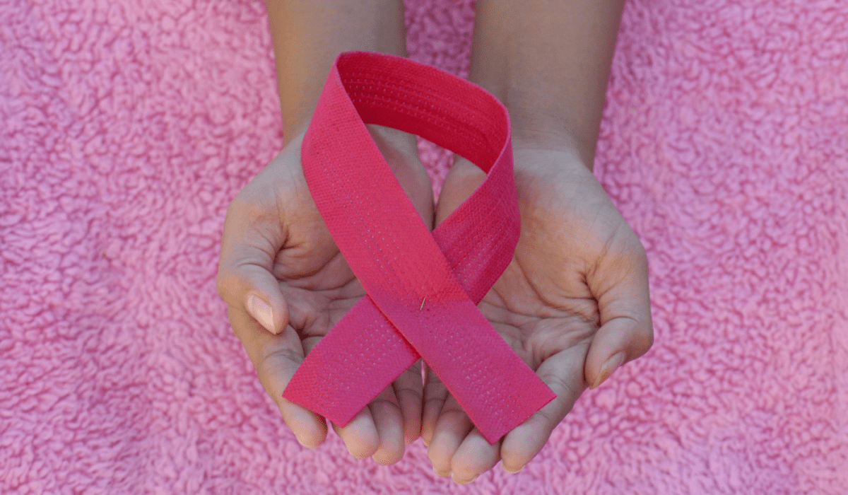 a person holding a ribbon